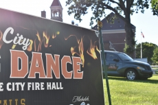 The Lake City Firemen’s Dance sign at the corner of High Street and Marion Street, just steps from the Lake City Fire Hall where the re-located fundraiser will be held Saturday, July 7. Visible at right is the raffle grand prize, a Chrysler PT Cruiser donated by Tom Heffernan Ford.
